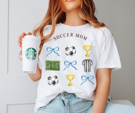 🏅🌟 Calling all sports moms! Our new tee drop is here to help you cheer on your little athletes in style. Whether you're on the sidelines for football, baseball, or soccer, these shirts are perfect for showing your team spirit. Get ready for an exciting season with your kids and grab your sports mom tee now! 🏈⚾⚽ Shop the link in bio! #SportsMomLife #TeamMom #SidelineStyle #FootballMom #BaseballMom #SoccerMom #etsy #etsyshop #etsyfinds #etsyseller #coquette Soccer Team Shirts, Vibe Blue, Mom Pride, Sport Mom, Vintage Soccer, Football Vintage, Coquette Vintage, Mom Design, Vintage Coquette