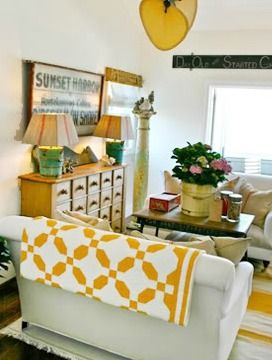 The Cozy Old "Farmhouse" Quilt Display, Two Color Quilts, Latest Interior Design Trends, Yellow Quilts, Interior Design Boards, Antique Quilts, White Quilt, A Living Room, Mellow Yellow