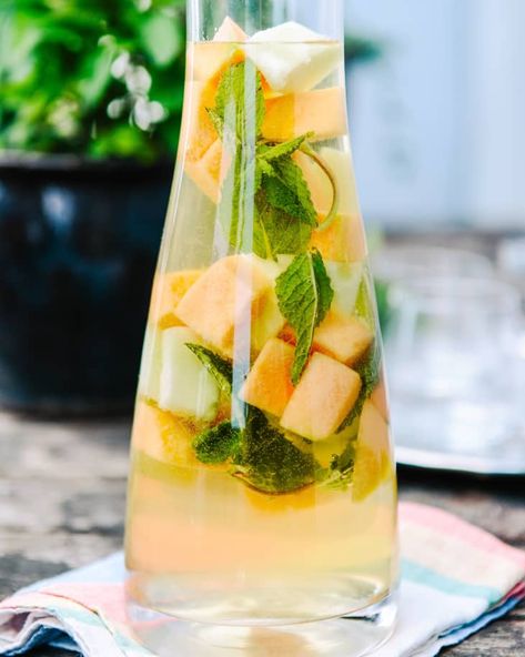 Recipe: Mixed Melon & Limoncello Sangria | The Kitchn Limoncello Sangria Recipe, Limoncello Sangria, Watermelon Uses, Layered Cocktails, Pineapple Mojito, Pitcher Cocktails, Frozen Limeade, Backyard Dinner Party, Batch Cocktails