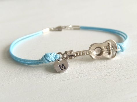 ***new silver and high quality charm***  This is a cute ukulele guitar bracelet, attached of a little coin with personalized letter. Its a double tie in light blue cotton cord. Charm is made of silver plated-brass, all matte finished and shine polished.  ◆ Charm is 1 inch. ◆ Please select the variation size, your personalized initial letter and color cord. See all letters in uppercase and lowercase (see the last image along with color chart).  ◆ Custom Personalized Letters: All initials are e... Cute Ukulele, Light Blue Jewelry, Guitar Bracelet, Guitar Light, Guitar Jewelry, Letter Jewelry, Musical Jewelry, Cord Jewelry, Music Jewelry