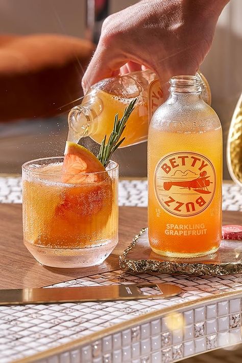 Post by Betty Buzz Betty Buzz Mocktail Recipes, Betty Buzz Cocktails, Cans Photography Drink, Beer Photography Styling, Budweiser Beer Aesthetic, Betty Buzz, Mastering Studio, Studio Product Photography, Beer Aesthetic