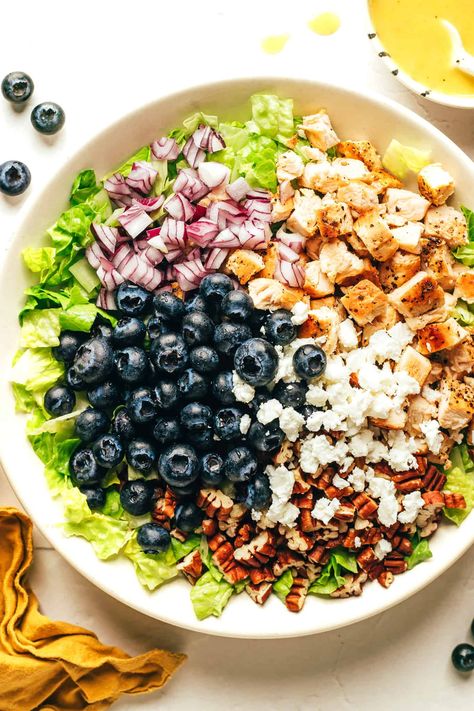 This blueberry chicken chopped salad recipe is loaded up with your choice of greens, tangy feta or goat cheese, diced red onion, toasted pecans, and tossed with a simple lemon vinaigrette. Feel free to swap steak, shrimp, salmon or roasted chickpeas as the protein. Always a delicious and healthy dinner! | gimmesomeoven.com Chicken Chopped Salad Recipes, Blueberry Salad Recipes, Blueberry Chicken, Blueberry Goat Cheese, Chopped Salad Recipe, Steak Shrimp, Blueberry Salad, Chopped Salad Recipes, Chicken Chopped Salad