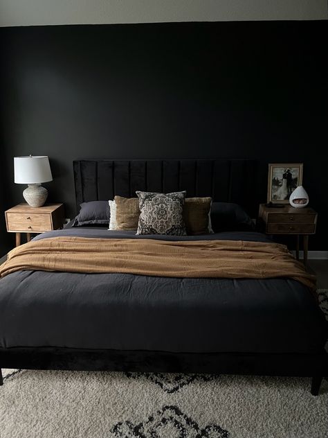 Black boho bedroom, modern organic, king bed with black linen duvet, black velvet headboard, natural wood nightstands, stone lamp, olive green velvet goose feather pillows, and burnt orange throw blanket Black Headboard Bedroom, Black Velvet Bed, Statement Bedroom, Olive Green Bedrooms, Bedroom Mirrors, Velvet Bed Frame, Moody Vintage, Black Bed Frame, Grey Bedroom Decor