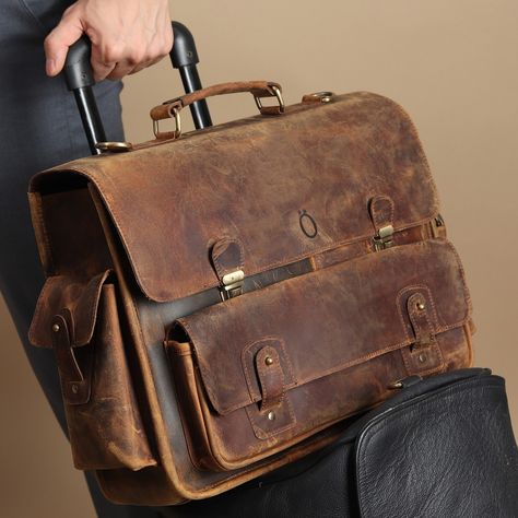 Step up your work game with style and comfort! Introducing our premium Ranga Laptop Leather Messenger bag — perfect for the modern professional on the go. 💻👔 ✨ Why You’ll Love It: 🔹 Sleek design meets spacious functionality 🔹 Made from high-quality genuine leather 🔹 Fits laptops up to 15 inches 🔹 Multiple compartments for smart organization 🔹 Trolly strap for easy carrying 🔹 Comfortable, padded straps for all-day wear 🔹 Personalize with name to make it a special gift Whether heading to a m... Luxury Waxed Finish Satchel Briefcase, Luxury Leather Strap Briefcase For Formal Use, Saffiano Leather Workwear Briefcase, Luxury Rugged Briefcase, Luxury Waxed Canvas Travel Briefcase, Luxury Rugged Satchel Briefcase, Luxury Rugged Briefcase For Travel, Luxury Waxed Canvas Satchel For Travel, Luxury Oiled Leather Satchel Briefcase