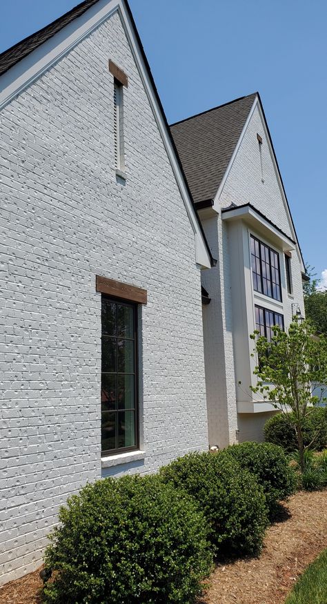 Gorgeous white brick home exterior painted with Keim Mineral Masonry paint. Textured Brick Exterior, Painted Brick Exterior House, Painted Stone House Exterior, Brick And Stucco Exterior Houses, Stucco Over Brick, Romabio Masonry Flat, Brick And Stucco Exterior, Painting Brick Exterior, Brick Painted White