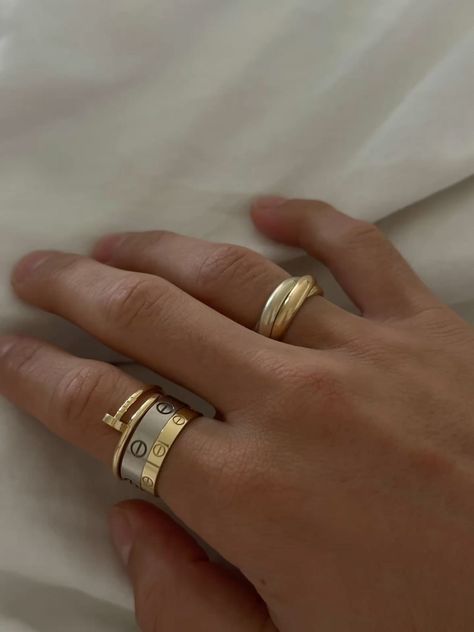 Cartier ring stack Cartier Love Ring As Wedding Band, Cartier Pinky Ring, Love Ring Cartier Stack, Cartier Trinity Ring Stack, Cartier Love Ring Aesthetic, Cartier Ring Aesthetic, Ring Stack Cartier, Cartier Love Ring Stack, Cartier Love Ring Wedding Band