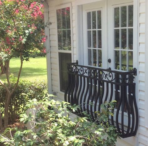 Add a faux balcony to your home for a unique splash of curb appeal. Bob Stevens' home look amazing with a faux balcony over exterior French doors that look over a garden. Faux Balcony, House Balcony Ideas, Iron Balcony Railing, Juliette Balcony, French Balcony, Window Awning, Juliet Balcony, Herbs Garden, House Balcony