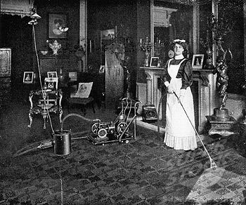 Maid vacuuming carpet, 1911 (using a natural gas powered vacuum cleaner, attached to the gas chandelier ...yikes!) Vintage Aprons, Cabinet Cards, Christmas Past, Futurism, Photo Puzzle, Retro Futurism, Wonderful Images, Picture Library, Art Studios