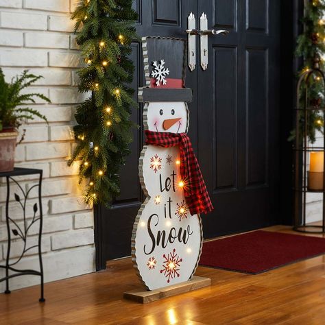 To celebrate and decorate your holiday with this snowman porch sign. It features a cute snowman wearing a plaid scarf, with a curved body and black hat, adorned with white snowflakes and holiday sentiments of a beautiful font. It's a perfect accent to place outside and near an entryway door. Seasonal sentiments and designs serve as an inspiring way to greet family and friends.1. Lighted porch sign, with 10 LED bulbs and 0.2W each bulb, 2AA batteries are needed but not included.2. With a flat woo Snowman Porch Decor, Frosted Mason Jars, Entryway Door, Festive Centerpieces, Wooden Snowman, Diy Ornaments, Christmas Wood Crafts, Snowman Decorations, Snowman Crafts