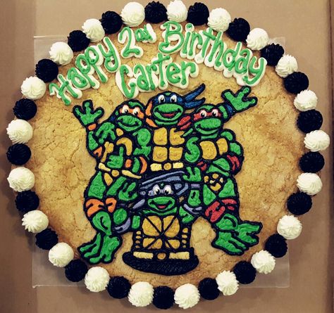 Teenage Mutant Ninja Turtles on a soft sugar cookie cake. Ninja Turtle Birthday Cookies, Ninja Turtle Pizza Cookies, Turtles Cookies, Teenage Mutant Ninja Turtle Cookies, Ninja Turtles Birthday Sheet Cake, Ninja Turtle Cookie Cake, Tmnt Cookies, Simple Ninja Turtle Cake, Ninja Turtle Cookies