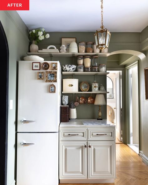 Olive green kitchen with custom shelving and antique pendant after renovation. West Elm Bathroom, Square Marble Table, Upper West Side Apartment, Build A Fireplace, Real Kitchen, Apartment Tour, Vinyl Floor Mat, Faux Fireplace, Cube Ottoman