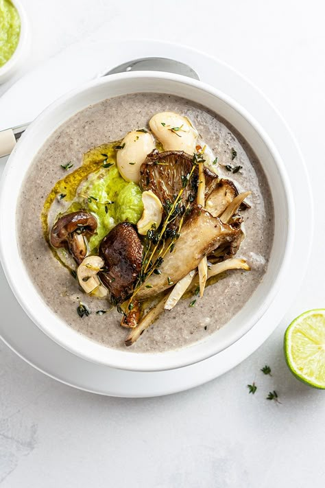 Made with a blend of cashews and white beans and topped with a leek purée, this vegan king oyster mushroom soup is creamy, hearty, and nutritious. vegan mushroom soup,king oyster mushroom soup,oyster mushroom soup vegan,cream of oyster mushroom soup,no cream mushroom soup #vegan #govegan #dairyfree #glutenfree #recipe #cooking #food Mushroom Plating, Oyster Mushrooms Recipes, Oyster Mushroom Soup, Mushroom Soup Without Cream, Turkey A La King, King Oyster Mushroom Recipe, King Mushroom, King Oyster Mushroom, Oyster Mushroom Recipe