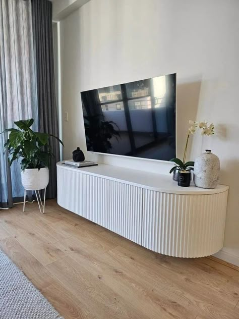 Living Room With Fluted Panel, Wall Cavity Ideas Living Room, Tv Unit With Floating Shelves, Curved Tv Unit Design, Tv Cabinet Design For Living Room Luxury, Fluted Tv Unit, Curved Tv Unit, Diy Tv Unit, Wall Mounted Entertainment Unit