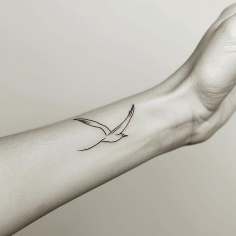 Embrace the freedom symbolized by this minimalist flying bird tattoo, gracefully adorning the wrist. Its delicate lines, accentuated by gentle lighting, invite you to soar in life. Save & follow for more. #MinimalistTattoo #FreedomInk #BirdTattoo #WristArt #SimpleElegance #InkInspiration #AIimage Bird Tattoo On Wrist, Minimalist Bird Tattoo, Gentle Lighting, Sunrise Tattoo, Tattoo On Wrist, Mama Tattoo, Freedom Tattoos, Bird Tattoo Wrist, Flying Bird Tattoo