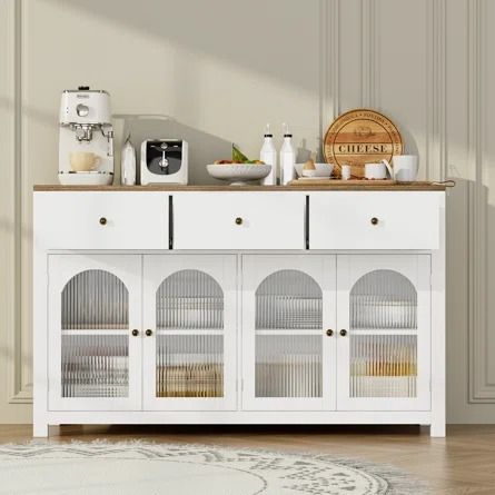 Wade Logan® Bonnetta 55.1"W 3 Drawer Sideboard Buffet, Modern Sideboard with Glass Doors - Wayfair Canada Sideboard With Glass Doors, Kitchen Cabinet Display, Farmhouse Kitchen Cabinet, Lower Cabinets, White Buffet, Cabinet Display, Wood Buffet, Farmhouse Kitchen Cabinets, Fluted Glass