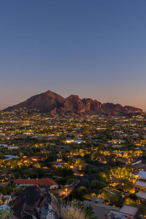 Camelback Mountain lit up with Scottsdale city lights for a magnificent view only available at this 2-acre lot in Paradise Valley, Arizona. City With Mountains, Arizona City At Night, Paradise Valley Arizona Houses, Phoenix City Aesthetic, Houses In Arizona, Arizona Neighborhood, Arizona Mansion, Camelback Mountain Arizona, Arizona Wallpaper