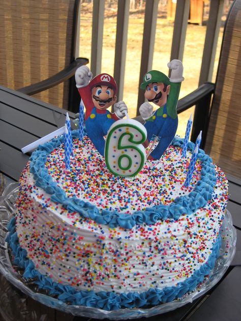 Mario & Luigi cake - I made my own ice cream cake (layer crushed oreo cookie, chocolate ice cream, crushed oreo cookie, chocolate ice cream, top with cool whip and sprinkles and pipe icing). Then I printed 2 Marios and 2 Luigis onto card stock. I cut them out and then, using 2-sided tape, attached them to toothpicks to insert into the cake. Mario Ice Cream Cake, Smash Bros Cake Birthdays, Luigi Cake Ideas, Mario Luigi Cake, Super Mario Ice Cream Cake, Super Mario Drip Cake, Luigi Cake, Super Mario Mystery Box Cake, Mario Brothers Birthday Party