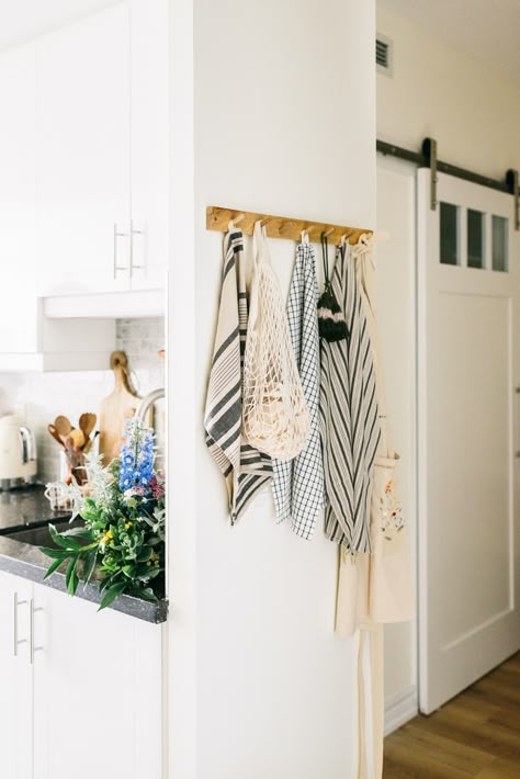 I love peg hooks, they save space and they create an apportunity to style a corner that may have been over looked. Apron Storage Kitchen, Pantry Hook Ideas, Hanging Hooks In Kitchen, Kitchen Apron Hanging Ideas, Wall Hooks In Kitchen, Hooks On Side Of Kitchen Cabinet, Peg Hooks Kitchen, Apron Hooks In Kitchen, Kitchen Wall Hooks