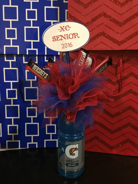 Super cute and fun center piece for a senior night or awards banquet for any sport!!                                                                                                                                                                                 More Cross Country Senior Night Ideas, Cross Country Decorations, Track Banquet, Cross Country Gift Ideas, Wrestling Banquet, Swim Team Party, Swim Banquet, Athletic Banquet, Cross Country Gift