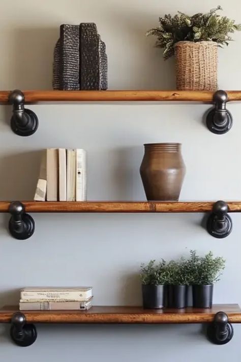 Transform your living space with trendy DIY industrial pipe shelving that mixes functionality with modern decor. This guide breaks down how to install sleek pipe shelves, providing a distinctive look for any room. Using readily available materials, you can easily enhance your home's aesthetic while maximizing storage. Perfect for showcasing books, plants, or decor items, these shelves fit seamlessly into any design style. Have fun creating rustic yet stylish home features that impress your guests and refresh your space. Shelves With Pipes Industrial Style, Piping Shelves, Galvanized Pipe Shelves, Plumbing Pipe Shelves, Pipe Shelf Brackets, Industrial Shelves, Pipe Shelving, Industrial Style Interior, Industrial Bookshelf