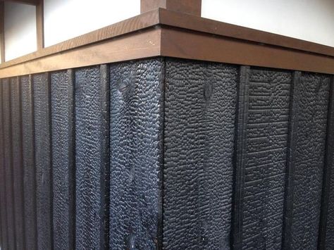 Traditionally, trim is often a slightly different color than the yakisugi (shou sugi ban) field. In this case it is intermediate between the jet black Suyaki and natural plaster upper wall. Japanese Exterior, Charred Wood Siding, Burnt Wood Finish, Wood Wall Covering, Fire Crafts, Burnt Wood, Charred Wood, Sugi Ban, Shou Sugi Ban