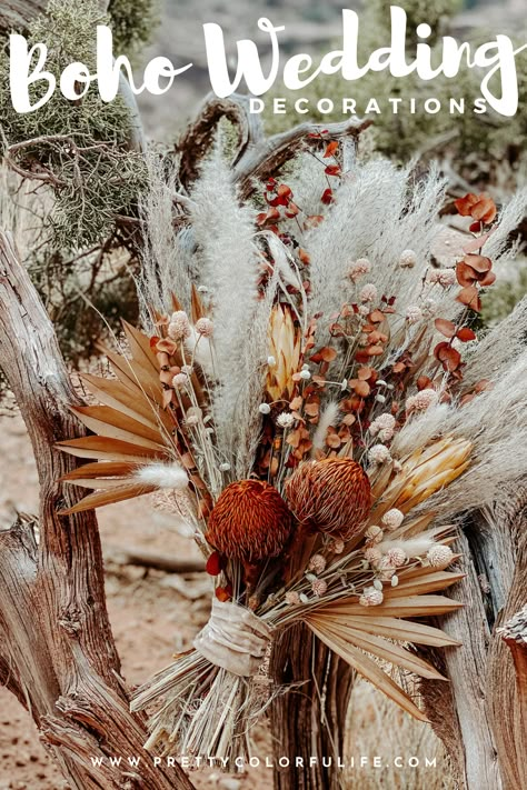 Tie the knot with a whimsical boho wedding. Decorate your outdoor wedding with my selection of 30 boho wedding decorations on a budget. Walk down the aisle to the love of your life on boho rugs, rustic chic floral aisle decorations, and a dried flower wedding bouquet. Celebrate your love with an outdoor wedding reception with boho centerpieces featuring dried floral arrangements and fresh flowers. Click the link to discover gorgeous bohemian wedding decorations. Boho Fall Centerpieces Wedding, Rustic Bohemian Wedding Table Decor, Boho Flower Centerpieces Wedding, Boho Wedding Pew Decor, Boho Wedding Aisle Decorations, Boho Chic Wedding Arch, Boho Rustic Flower Arrangements, Diy Boho Floral Swag, Boho Wedding Centerpieces Diy Wedding Table Decor