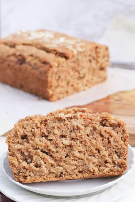 This easy, healthy recipe for Cinnamon Applesauce Oat Bread will get anyone baking! Gluten-free, low in sugar (only 1/2 cup of brown sugar) with high altitude tips; this loaf is moist and lightly sweetened with apple, and made healthier with coconut oil, applesauce, and oats. The perfect Fall breakfast, or breakfast or snack anytime with it's classic, simple flavors. Healthier Breakfast, Applesauce Bread, Cinnamon Applesauce, Oat Bread, Oatmeal Bread, Cinnamon Oatmeal, Cinnamon Recipes, Cinnamon Flavor, Gluten Free Snacks