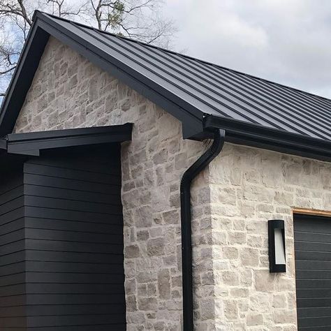 Stone House Metal Roof, Stone Garage Exterior, Black And Stone Exterior, Stucco And Board And Batten Exterior, Over Grouted Stone Exterior, Exterior Stone Ideas, Exterior Rock Siding, Stone Garage, Outside House Paint