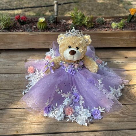 Ideal bear for your quinceanera party, it measures approximately 17" Each dress of our bears is custom designed matching the tone to the color of your quinceanera dress. It is worth mentioning that the tone of the fabric may vary, as well as the accessories (crown, earrings or necklace) If you need a more personalized bear or the same as your dress, it can also be made. Our specialty is satisfying our clients. You can contact us if you require a custom design. Contact: 817-443-7252 FB: Norma Vazquez Fashion Designer https://www.facebook.com/profile.php?id=100077462744454 Quinceanera Doll Light Purple, Quince Doll Purple, Garden Quince, Quince Bear, Rapunzel Quinceanera, Light Purple Quinceanera Dresses, Quinceanera Bear, Rapunzel Quince, Purple Quinceanera Theme