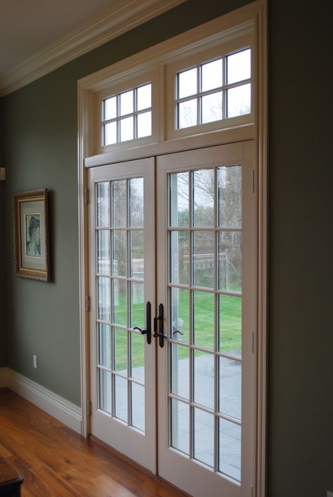 Large French doors with transom windows. #FrenchDoors #TransomDoor #CoastalHome Sliding Door With Transom, Exterior French Doors With Transom, Patio Door With Transom Window, French Door With Transom Window, Sliding Glass Door With Transom Window, French Doors Transom Windows, Farmhouse Patio Doors, French Doors With Transom, Farmhouse Interior Doors