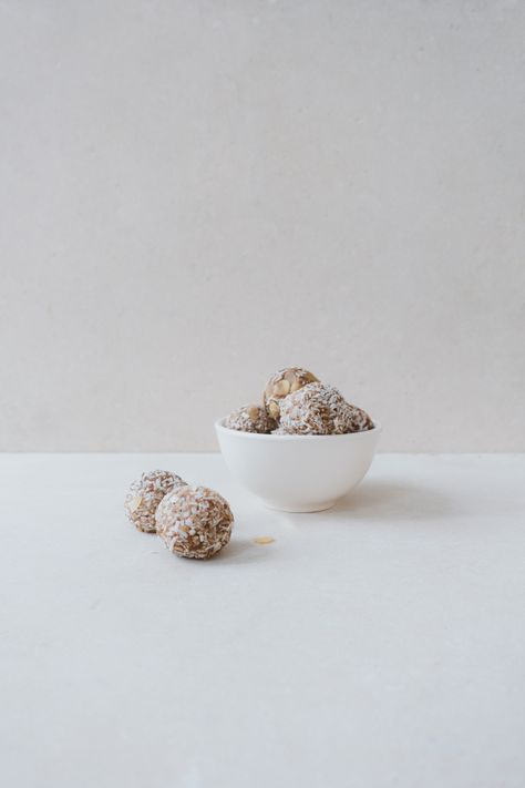 These Coconut Almond Bliss Balls are made with wholesome oats, flaxseeds, and dates, then blended with almond butter and a hint of maple syrup. Each bite is rolled in shredded coconut and almond shavings for a treat that’s as satisfying as it is delicious. Coconut Date Balls, Date Balls, Kale Caesar Salad, Carrot Ginger Soup, Coconut Shavings, Green Pesto, Chickpea Stew, Bliss Balls, Carrot And Ginger