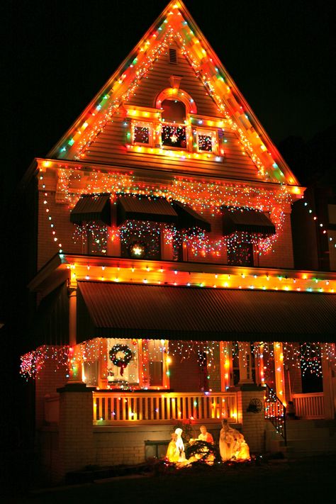 Christmas House Lights at Night. This one artful, not tacky. Rainbow Christmas Lights On House, Rainbow Christmas Lights Outdoor, Outdoor Christmas Lights Colored, Colored Christmas Lights On House, Christmas Lights On House, Auntie Claus, Christmas Lighting Ideas, Professional Christmas Lights, Multi Colored Christmas Lights