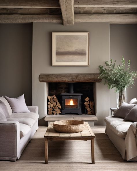 A Farmhouse Minimalist Living Room Faux Log Burner Fireplace, Modern Woodburner Ideas, Log Burner Aesthetic, British Living Room Interior Design, Cosy White Living Room, Log Burner Fireplace Ideas Modern, Woodburner Fireplace Ideas, Log Burners In Living Room, Small Living Room Fireplace Ideas