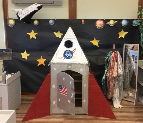 Easy Space Decorations, Outer Space Trunk Or Treat, Preschool Outer Space Dramatic Play, Space Theme Book Fair, Diy Rocket Ship Cardboard Space Party, Rocket Ship Dramatic Play Outer Space, Rocket Ship Bulletin Board Outer Space, Camping Preschool, Diy Rocket