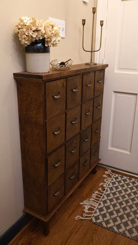 Do you have a small entryway? or do you not want to take up a lot of space in your entryway? This skinny 4 drawer shoe cabinet is perfect for you. It will add a ton of storage without taking up a ton of space. It'll make your entryway cleaner and more inviting. Plus the faux apothecary look will add style to any space. Cottage Shoe Storage, Shoe Storage Cabinet Ideas, Entryway Table And Shoe Storage, Entryway Dresser Ideas, Vintage Shoe Storage Ideas, Boot Room Entrance Hall, Small Apothecary Cabinet, Shoe Cabinet Entryway Decor, Vintage Shoe Rack