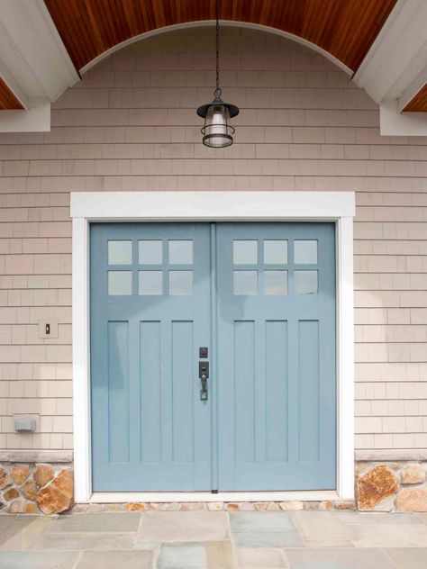 This cool grayish-blue (Behr’s Oslo Blue) makes a great complementary pairing with the warm neutral palette of the surrounding house. The color also echoes the soft blues on the stone porch. Curb Appeal Porch, درابزين السلم, Tan House, Blue Front Door, Blue Doors, Front Door Paint Colors, Door Colors, Door Paint Colors, Painted Front Doors