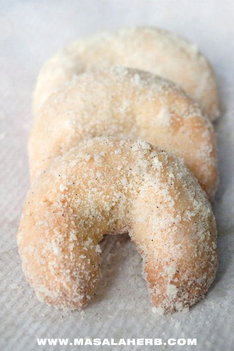 Vanillekipferl are vanilla flavored,aromatic and melt in the mouth crescent shaped cookies from my hometown in Austria. This recipe of vanilelkipferl is egg-less too and you can make it vegan with margarine. Learn how to make these vanilla crescent shaped cookies easily with the step by step instructions and pictures. Vanilla Kipferl, Cookies Without Eggs, Eggless Cookie Recipes, German Christmas Cookies, Crescent Cookies, Eggless Cookies, Popular Cookies, Austrian Recipes, Eggless Recipes