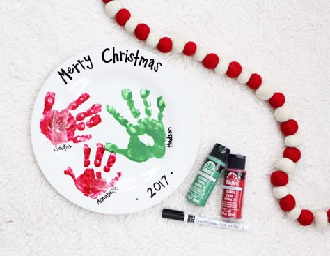 I started a new tradition this year and I LOVE it. A fun and sweet handprint plate. I plan to make one every Christmas so we can docum... Handprint Plate, Diy Christmas Plate, Handprint Christmas Tree, Handprint Christmas, Cookies For Santa Plate, The Red Shoes, Christmas Plate, Christmas Gift Basket, Christmas Plates