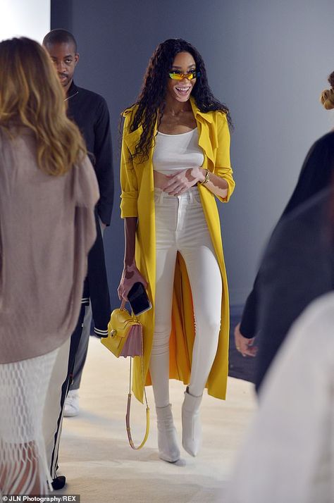 Dressed to impress: Top model Winnie Harlow looked glam in a yellow coat over white skinni... #artbasel #winnieharlow #model Yellow And White Outfits For Women, Yellow White Outfit, Styling Yellow Jacket, Yellow Coat Outfit Winter, White And Yellow Outfit, All Yellow Outfit, Chic Yellow Outerwear For Day Out, Yellow Outfits For Women, Yellow And White Outfit