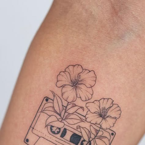 Casette Tape Tattoo Simple, Music And Travel Tattoo, Cassette Tape Tattoos, Tape Recorder Tattoo, Cassette Tapes Tattoo, Cassette Tape Tattoo Minimalist, Subtle Music Tattoo, Floral Music Tattoo, Millennial Tattoos