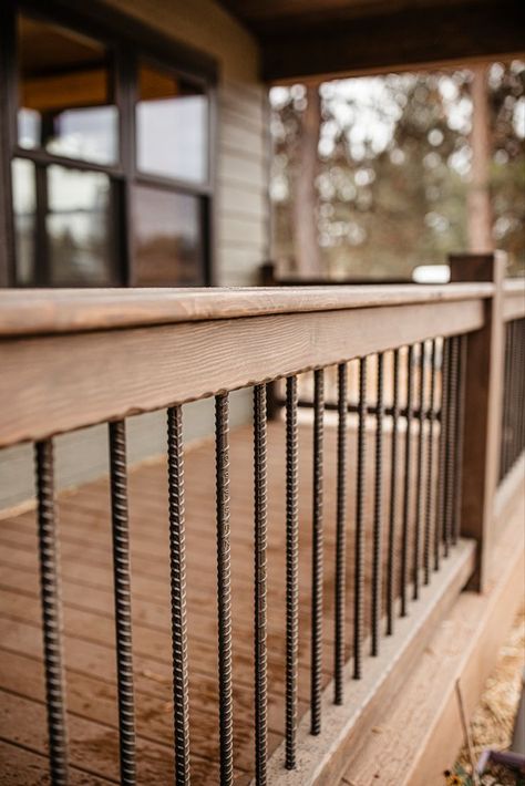 Rebar Handrail Deck Railings, Vertical Rebar Railing, Porch Railing Rebar, Porch Rails With Rebar, Western Deck Railing Ideas, Rustic Front Porch Ideas Railing, Porch Railing With Rebar, Wooden Front Porch Railings, Wood Patio Railing Ideas