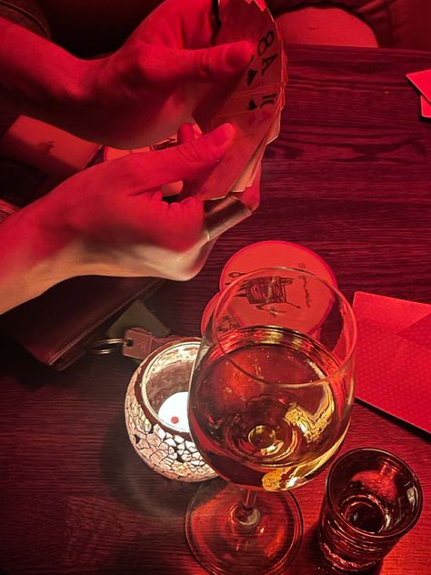 girls night out, club, cards, wine, wine lover, date night, inspo, aesthetic, red light, poker, moody lighting, candles, manly hands, veins Girls Poker Night, Orange Lighting Aesthetic, Poker Night Aesthetic, Manly Hands, Hands Veins, Poker Aesthetic, Drinking Wine Photography, Wine Gallery, Pretty Poison