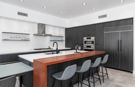 modern style kitchen with elevated wooden seating ledge on island Breakfast Bar Design, Elevated Kitchen, Wooden Seating, Modern Style Kitchen, Bar Design Ideas, Industrial Style Kitchen, Space Dividers, Countertop Surfaces, Modern Kitchen Island