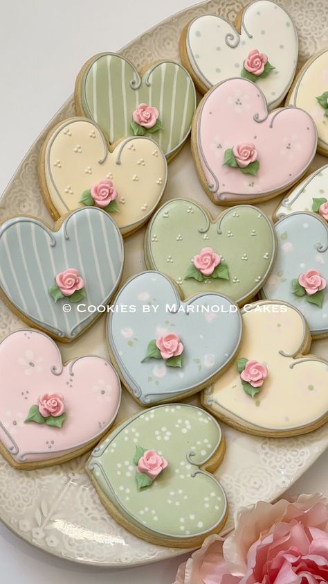 "A dozen of Shabby Chic themed Heart Cookies with Rosebud accent in the large size 3\". Design will have an assortment of patterns and colors, feminine, dainty, pretty chic. They will be individually wrapped in self-adhesive resealable cellophane. Since these cookies are handmade individually, please note that there will be some slight variations in color and size. Prepared and processed in a kitchen where allergens such as dairy, almonds, and other nuts or nut bi-products are used. If any of th Cottage Core Cookies, Royal Icing Heart Cookies, Rose Gold Cookies Decorated, Heart Royal Icing Cookies, Vintage Decorated Cookies, Cute Sugar Cookies Designs, Coquette Cookies, Cookies Design Ideas, Sugar Cookie Heart Designs