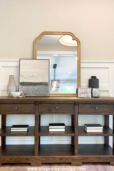 sofa table decor, layered art Art Leaning Against Wall, Classic Homes, Layered Art, Church Stage, Virginia Homes, Falls Church, Model Home, Large Mirror, Classic House