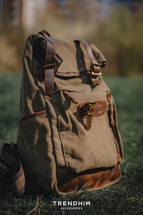 A camo green backpack for men with brown leather details placed on a grass. Backpack Aesthetic, Square Backpack, Aesthetic Backpack, Festival Essentials, Green Backpacks, Rugged Men, Holiday Packing, Practical Bag, Bags For Men