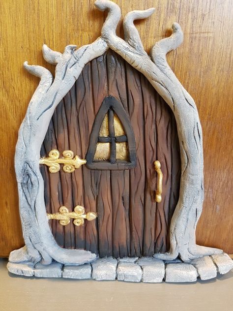 Fairy Door with driftwood surround. Books Nooks, Fairy Tail House, Polymer Clay Fairy Doors Diy, Clay Fairy Doors, Fairy Doors On Wall, Fairy Door Designs, Air Dry Clay Fairy Door, Faerie Door, Diy Fairy Door