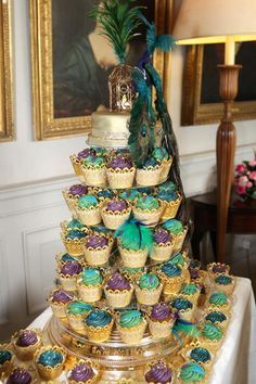 purple and green peacock theme cupcakes Peacock Cupcakes, Wedding Peacock, Peacock Wedding Cake, Peacock Cake, Peacock Party, Peacock Wedding Theme, Peacock Theme, Peacock Wedding, English Wedding