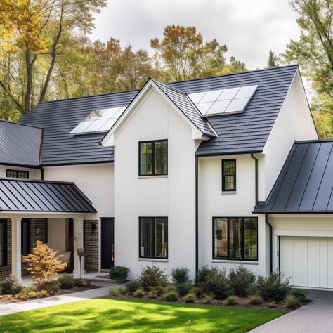 Suburban house with a metal shingle roof and solar panels. Metal Shingle Roof Houses, Houses With Dark Roof, Metal Roof With Solar Panels, Mixed Roofing Materials, Metal Shingles Roof, Ash Gray Metal Roof, Shingle And Metal Roof Combination, Metal Roof Colors Schemes, Metal Roofs On Houses