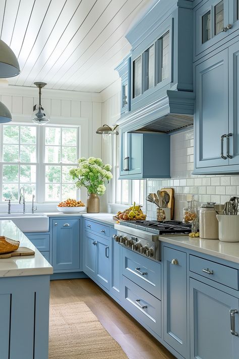 Country Blue Kitchen Serenity | Baby blue cabinetry with a gentle matte finish • Pristine white subway tile backsplash • Classic farmhouse sink with gooseneck faucet • Bright natural light from paneled windows • Grooved cabinet details for a traditional touch • Industrial-style pendant lighting • Beadboard ceiling enhancing the cottage feel • Quartz countertops for durable elegance • Warm natural wood flooring complementing the cool tones of the cabinetry. Rustic Kitchen Blue, Blue Aesthetic Home Decor, Blue Aesthetic Home, Blue Kitchen Tile, Country Blue Kitchen, Blue Tile Backsplash Kitchen, Blue Backsplash Kitchen, Blue Cabinetry, Blue Kitchen Tiles